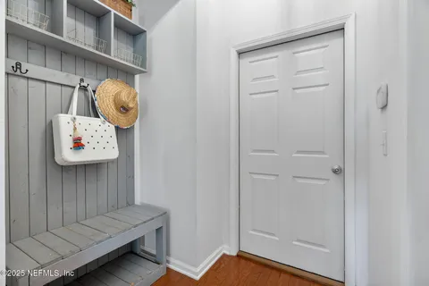 a view of a house with a swimming pool and sitting area