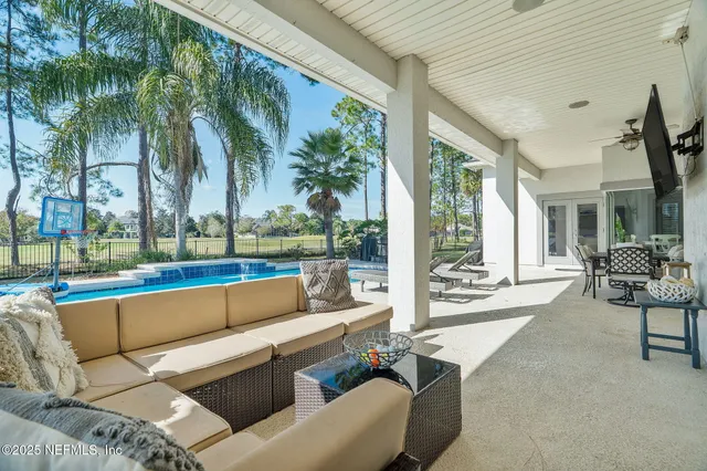 an aerial view of residential houses with outdoor space and street view