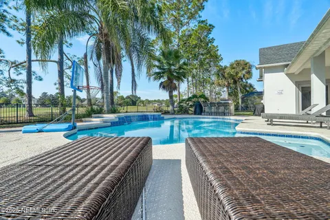 a sign board with buildings in the background