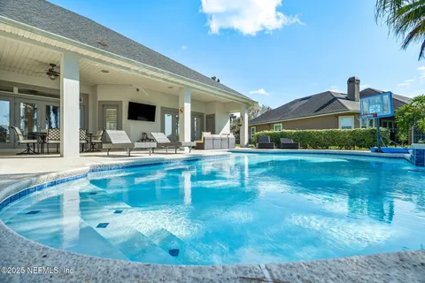 an aerial view of houses with a lake
