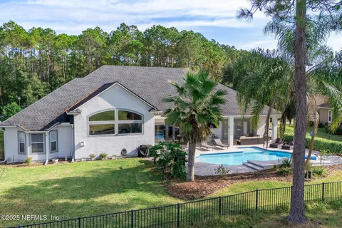 a kitchen with stainless steel appliances a refrigerator and a stove top oven