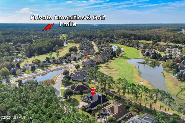 a dining room with wooden floor a chandelier fan a wooden table and chairs