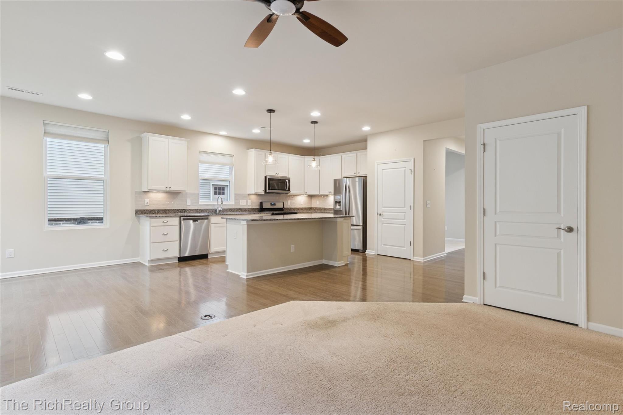 49534 Mapleton Road Canton, MI 48188 - Photo 37 of 37 Kitchen featuring open floor plan, white cabinets, tasteful backsplash, stainless steel appliances, and recessed lighting