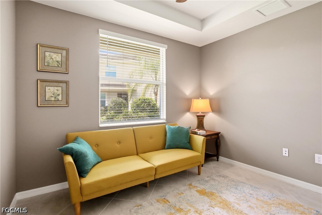3751 Pebblebrook Ridge Court, Unit 101 Fort Myers, FL 33905 - Photo 27 of 48 a living room with furniture and a window