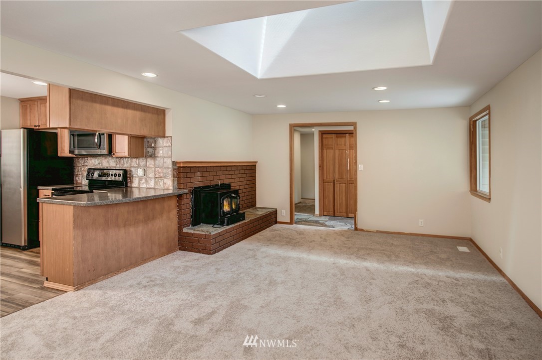 14437 157th Place Southeast Renton, WA 98059 - Photo 4 of 18 a view of a livingroom with a fireplace