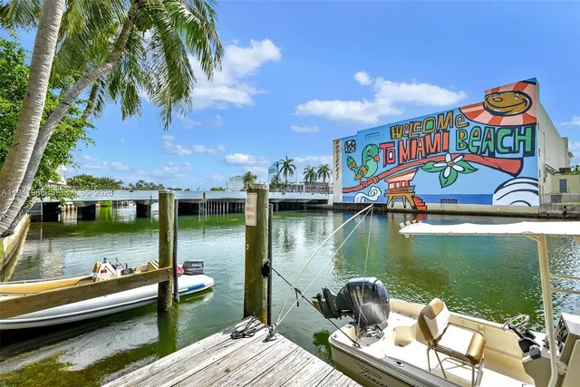 a wooden floor with boats in a lake