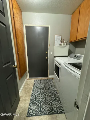 a view of a kitchen from the hallway