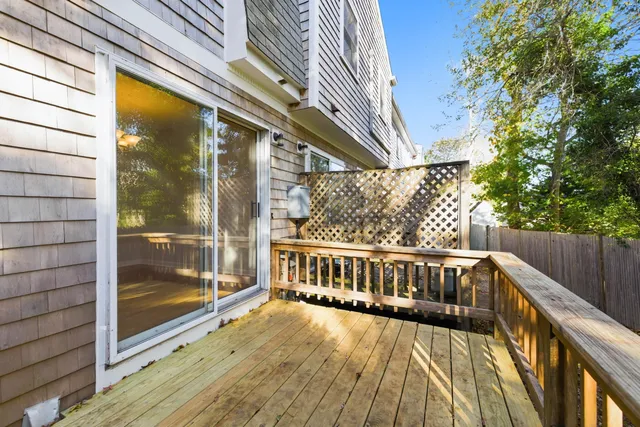 a view of balcony with wooden floor