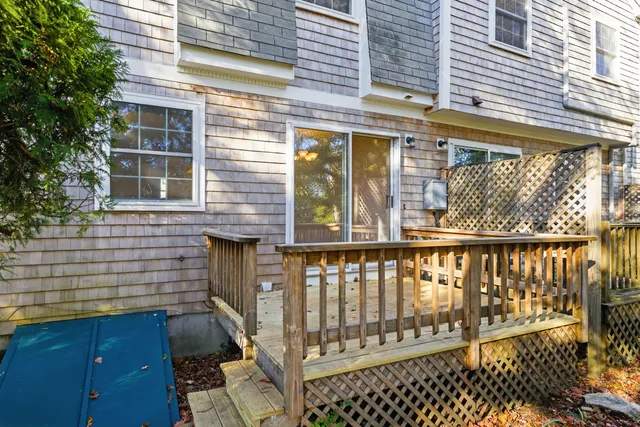 a view of a brick house with a large window