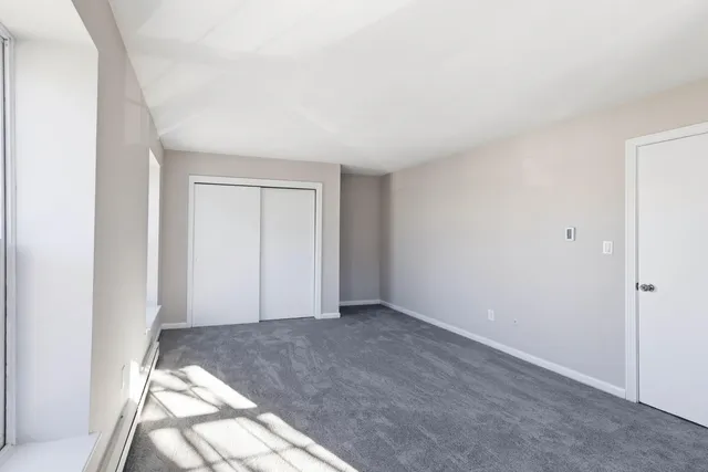 a view of an empty room and window