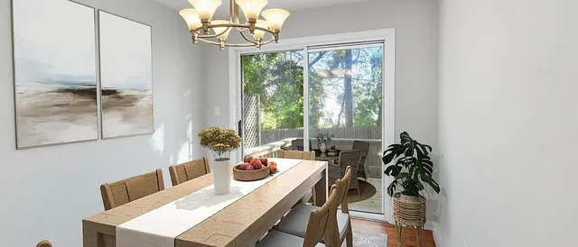 a view of a dining room with furniture window and outside view