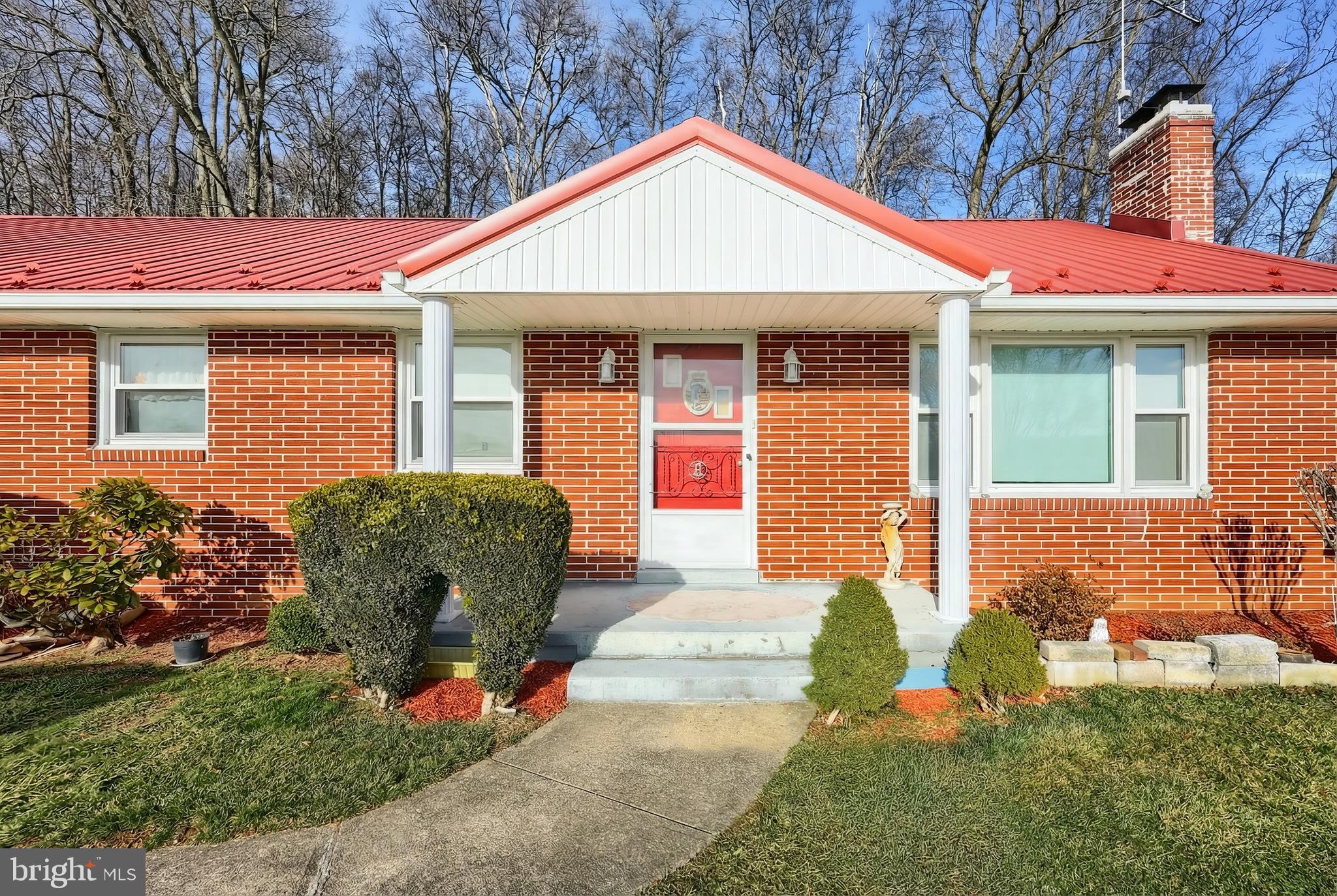1365 Burkholder Road Red Lion, PA 17356 - Photo 11 of 34 a front view of a house with garden