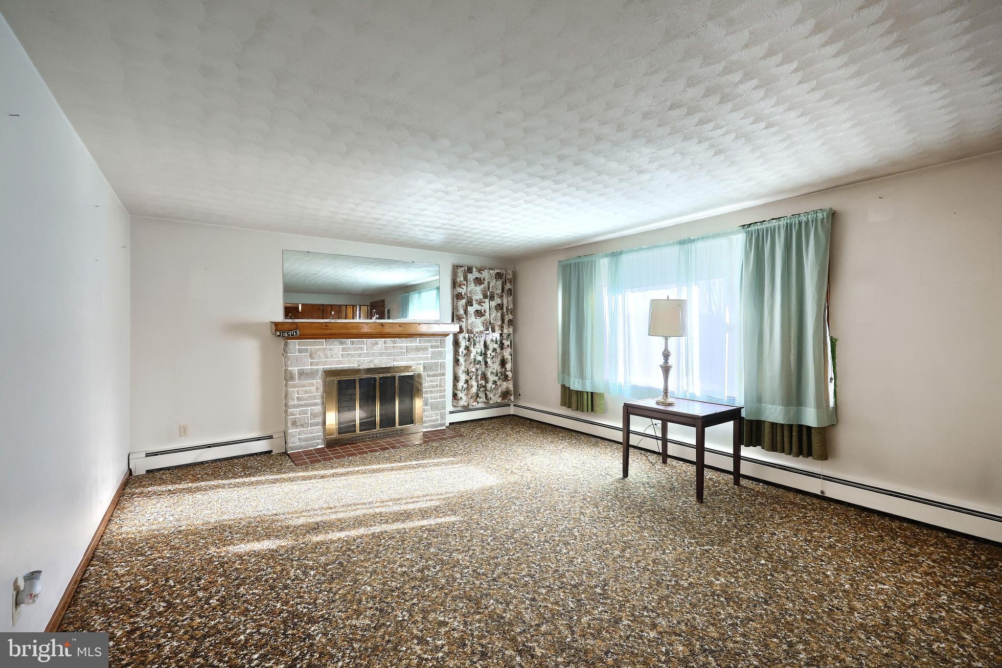 1365 Burkholder Road Red Lion, PA 17356 - Photo 15 of 34 an empty room with furniture and a fireplace