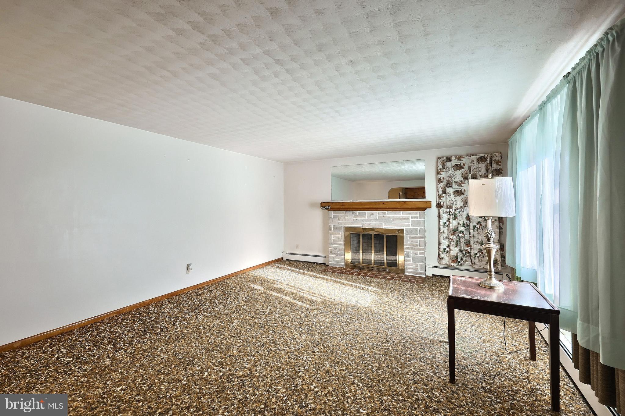 1365 Burkholder Road Red Lion, PA 17356 - Photo 16 of 34 a view of a livingroom with a fireplace