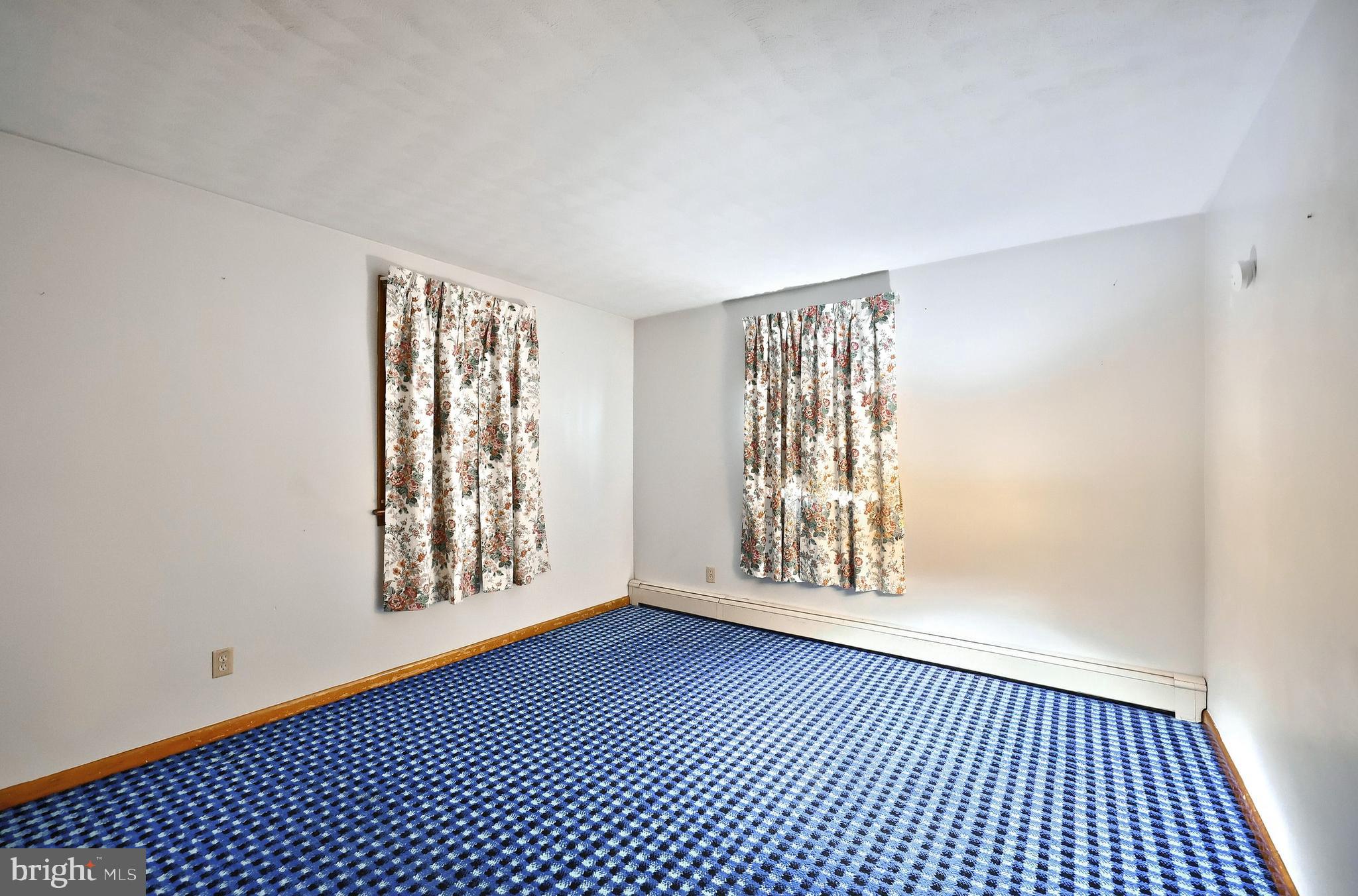 1365 Burkholder Road Red Lion, PA 17356 - Photo 22 of 34 a view of an empty room with glass door and windows