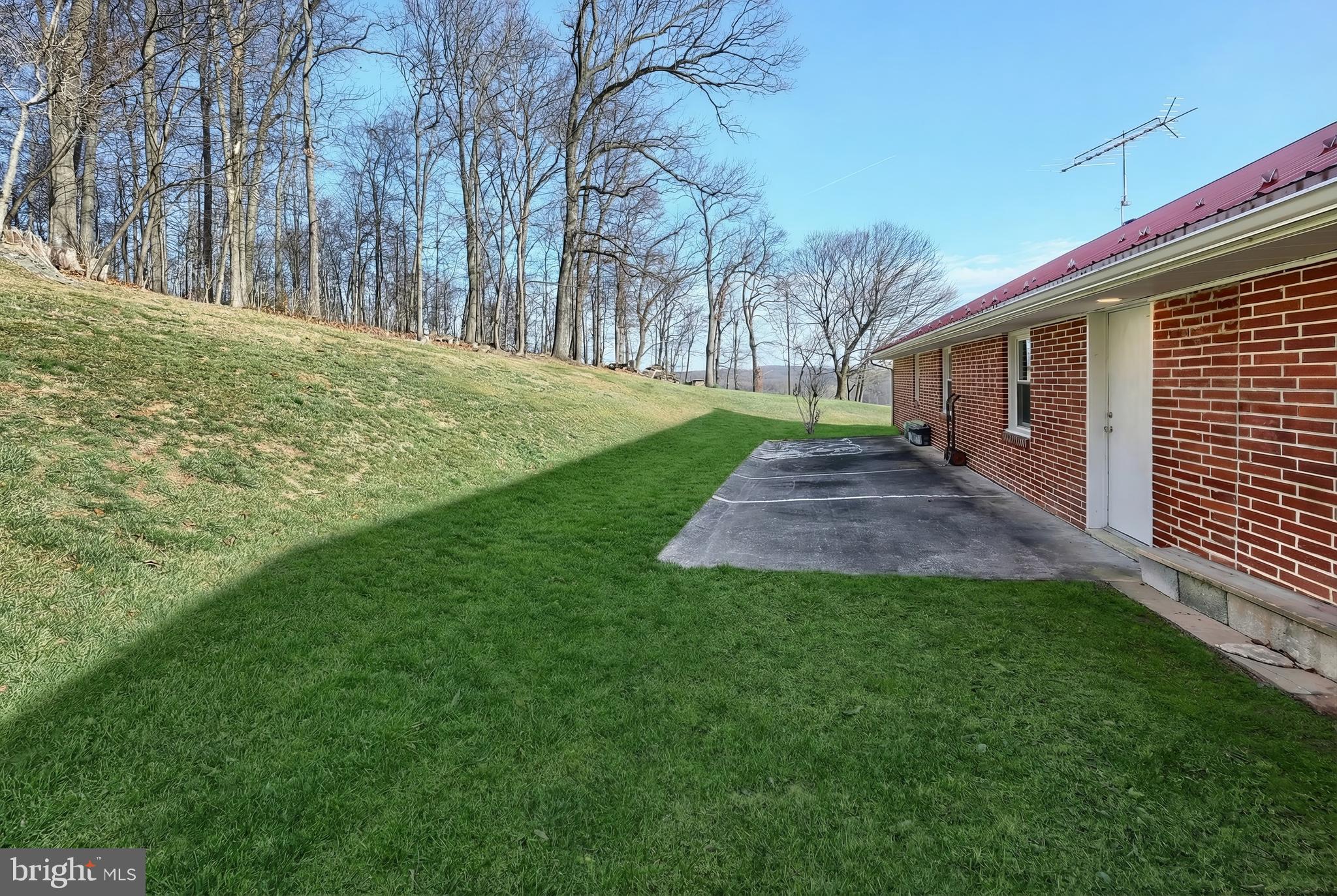 1365 Burkholder Road Red Lion, PA 17356 - Photo 7 of 34 a view of a backyard with large trees