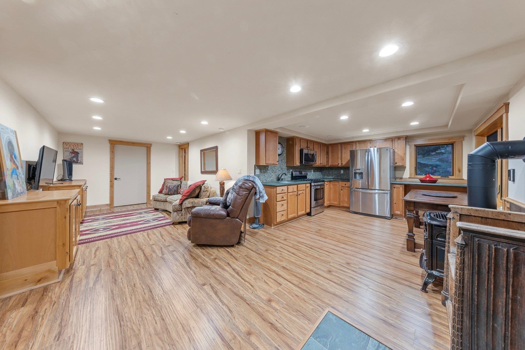 6442 Donner Road Tahoe Vista, CA 96148 - Photo 15 of 28 a living room with furniture and a wooden floor