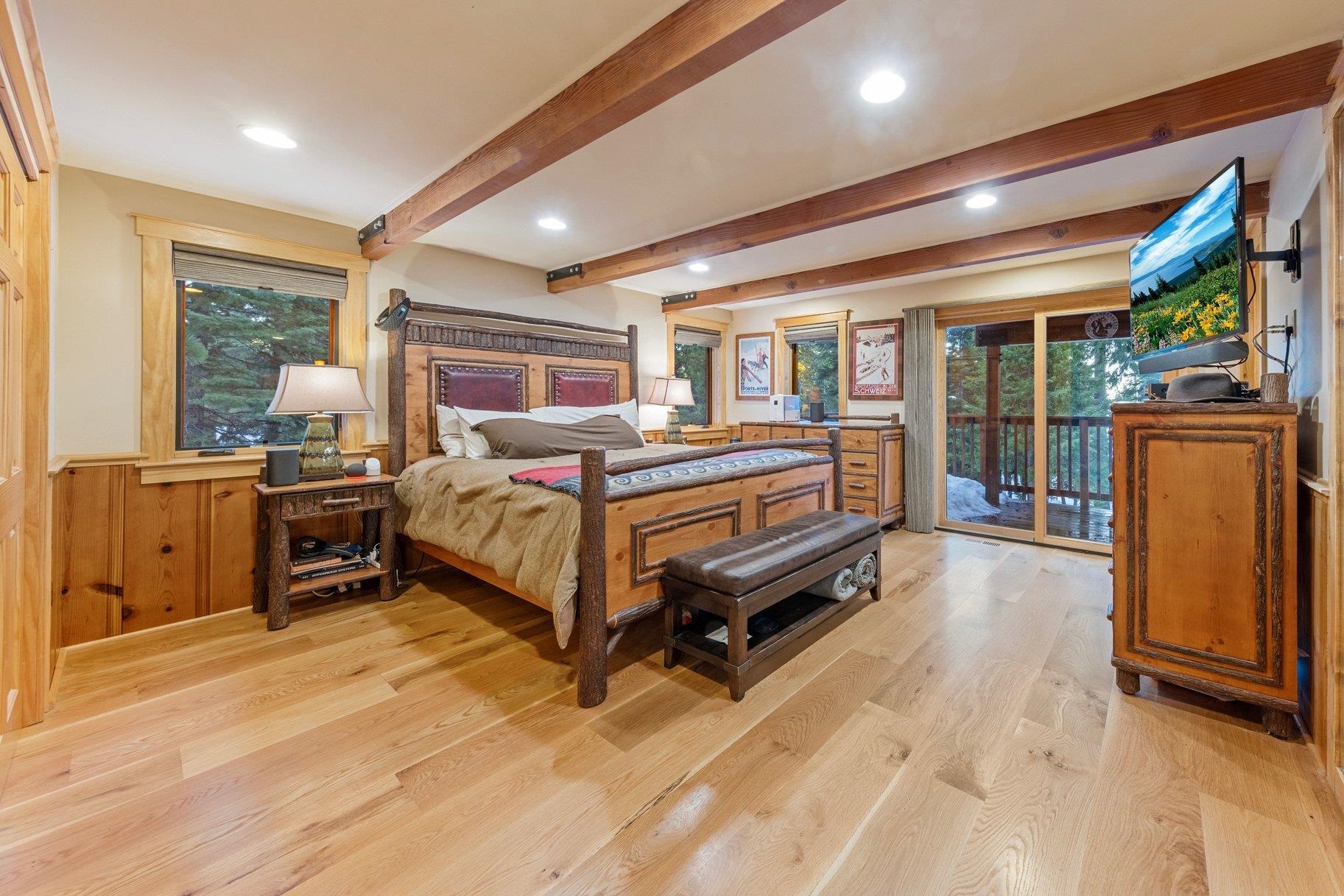 6442 Donner Road Tahoe Vista, CA 96148 - Photo 10 of 28 a bedroom with a bed and wooden floor