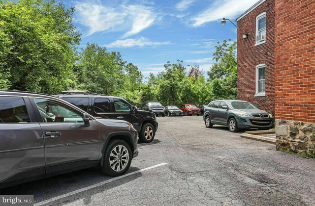 a view of a car parked in front of a house