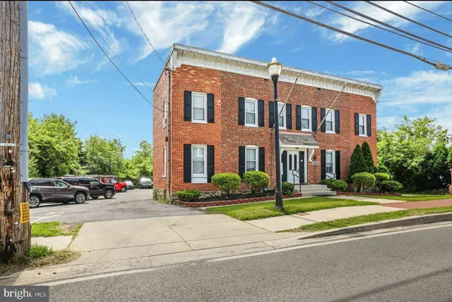 a view of a building with a street