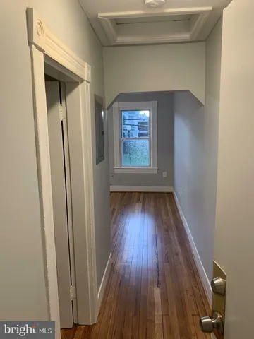 a view of front door with wooden floor