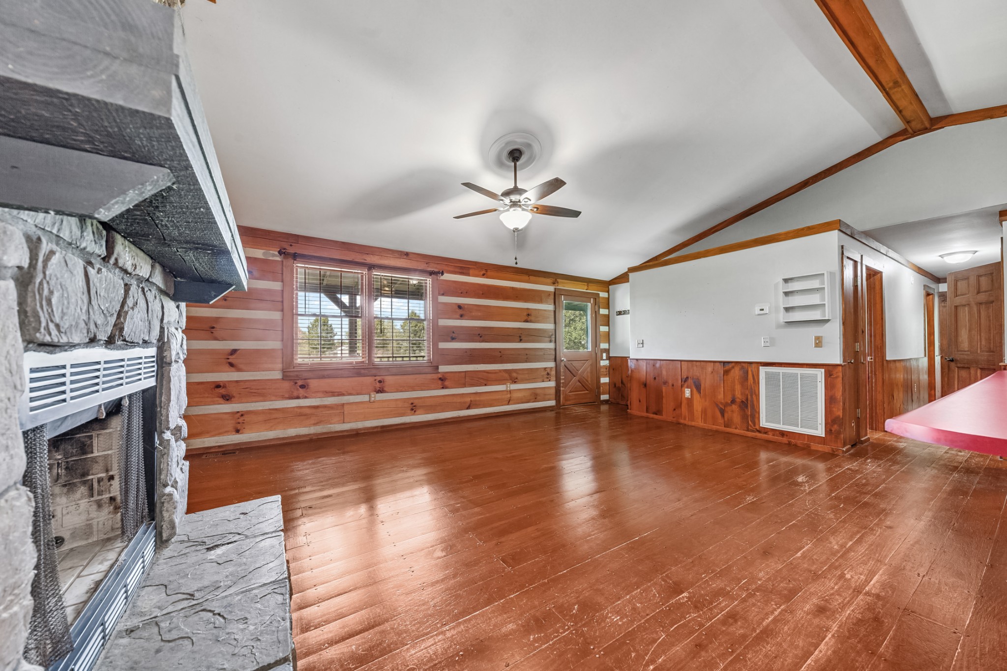 2151 Maysville Road Dickson, TN 37055 - Photo 39 of 98 a view of a livingroom with wooden floor a ceiling fan and windows
