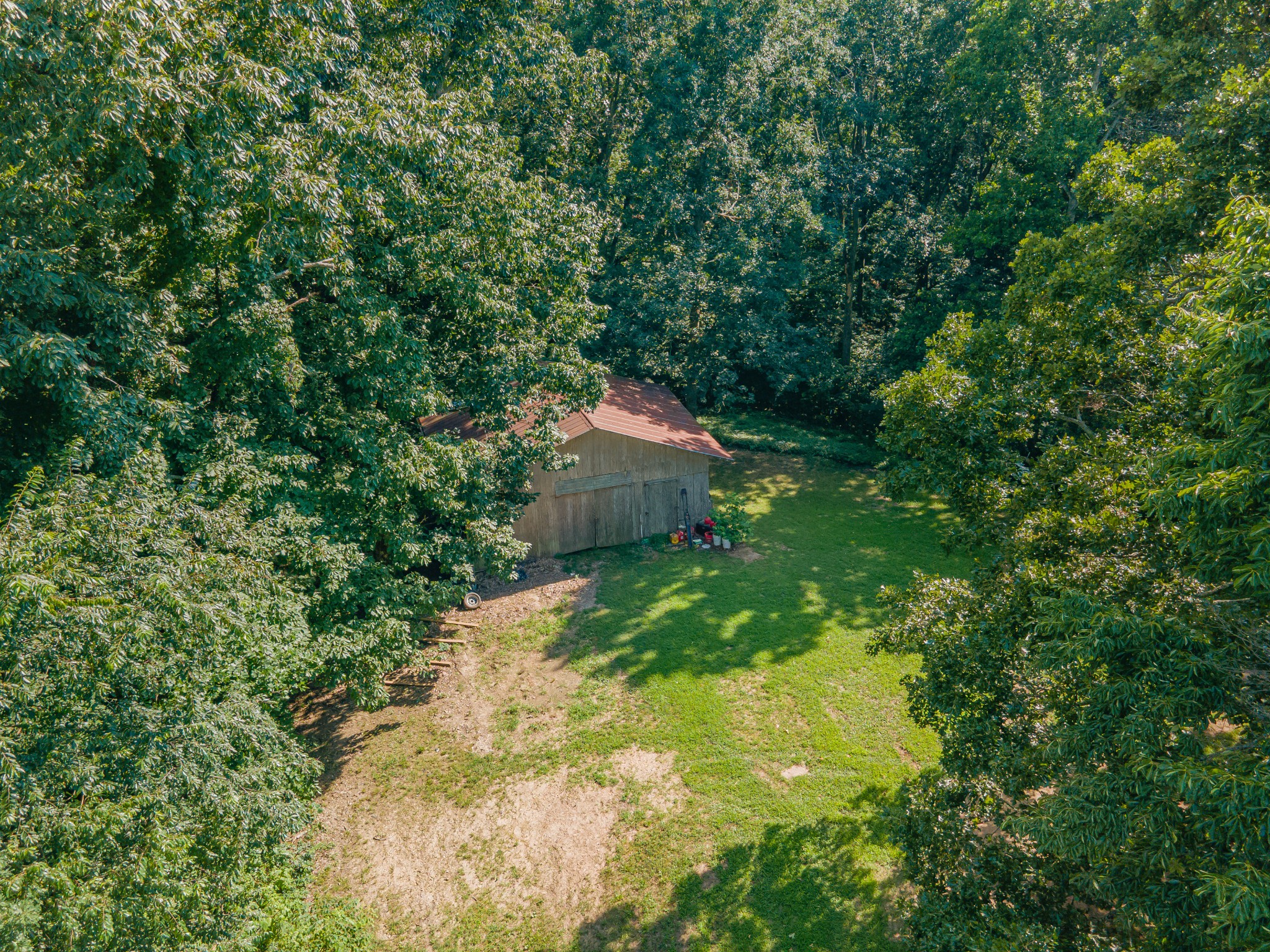 2151 Maysville Road Dickson, TN 37055 - Photo 6 of 98 a backyard of a house with a yard and large tree