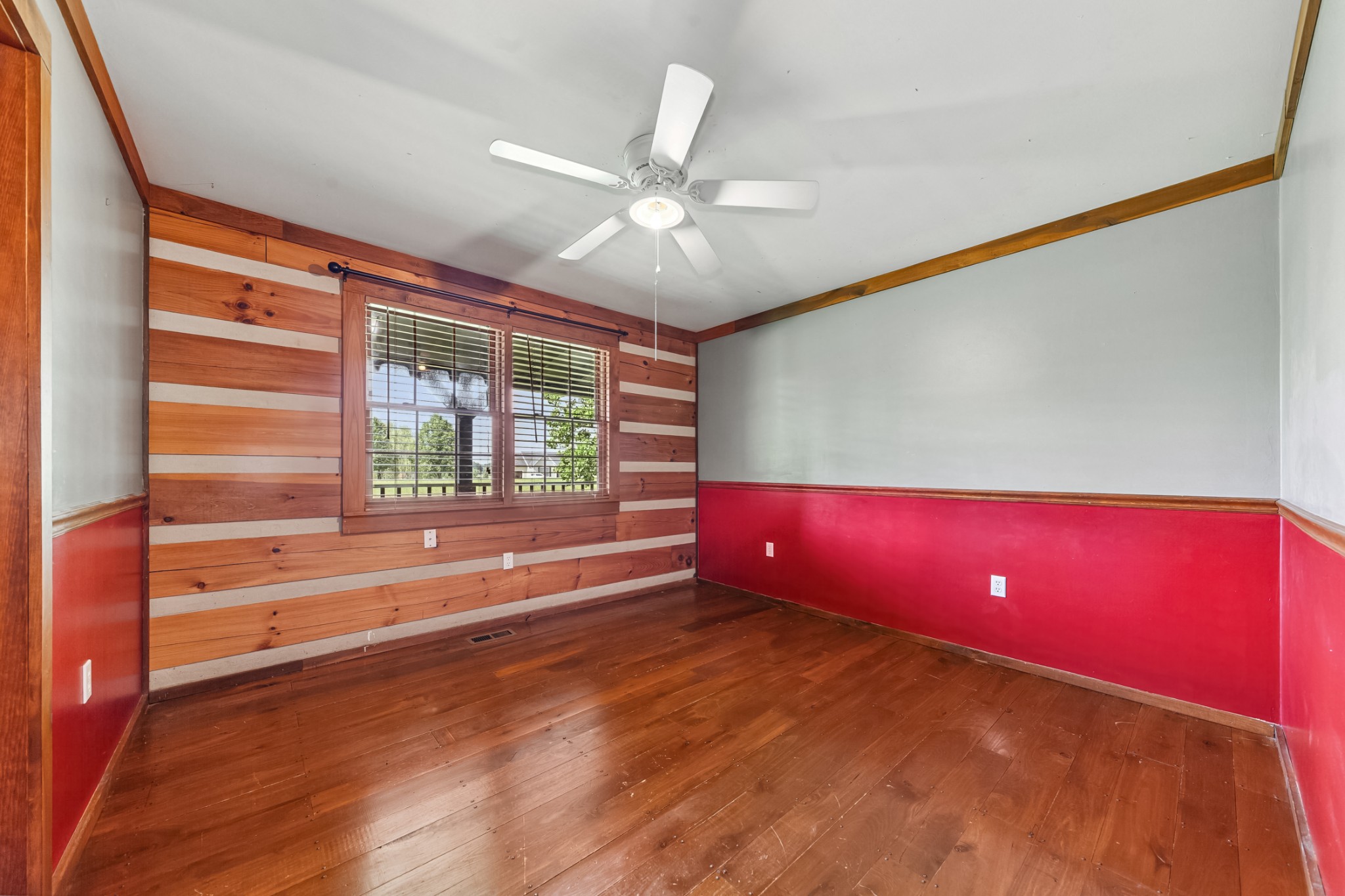 2151 Maysville Road Dickson, TN 37055 - Photo 64 of 98 a view of an empty room with a window and wooden floor