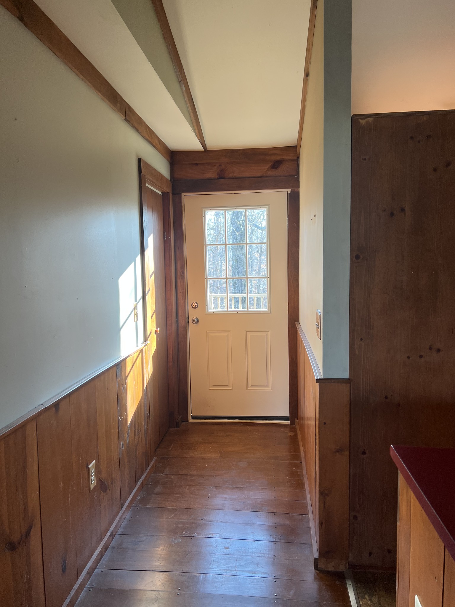 2151 Maysville Road Dickson, TN 37055 - Photo 67 of 98 an empty room with wooden floor and windows with curtains