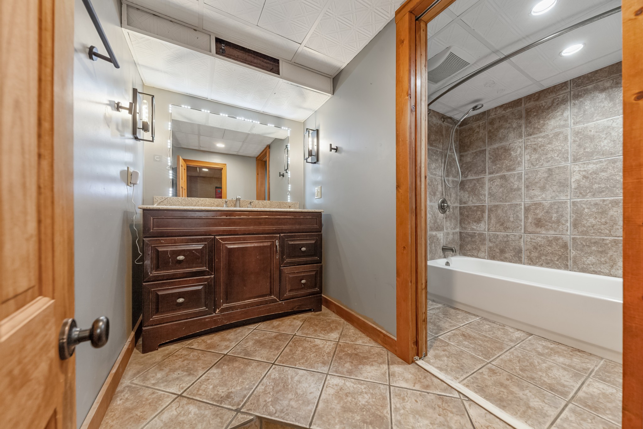2151 Maysville Road Dickson, TN 37055 - Photo 72 of 98 a bathroom with a granite countertop sink a mirror and a bathtub
