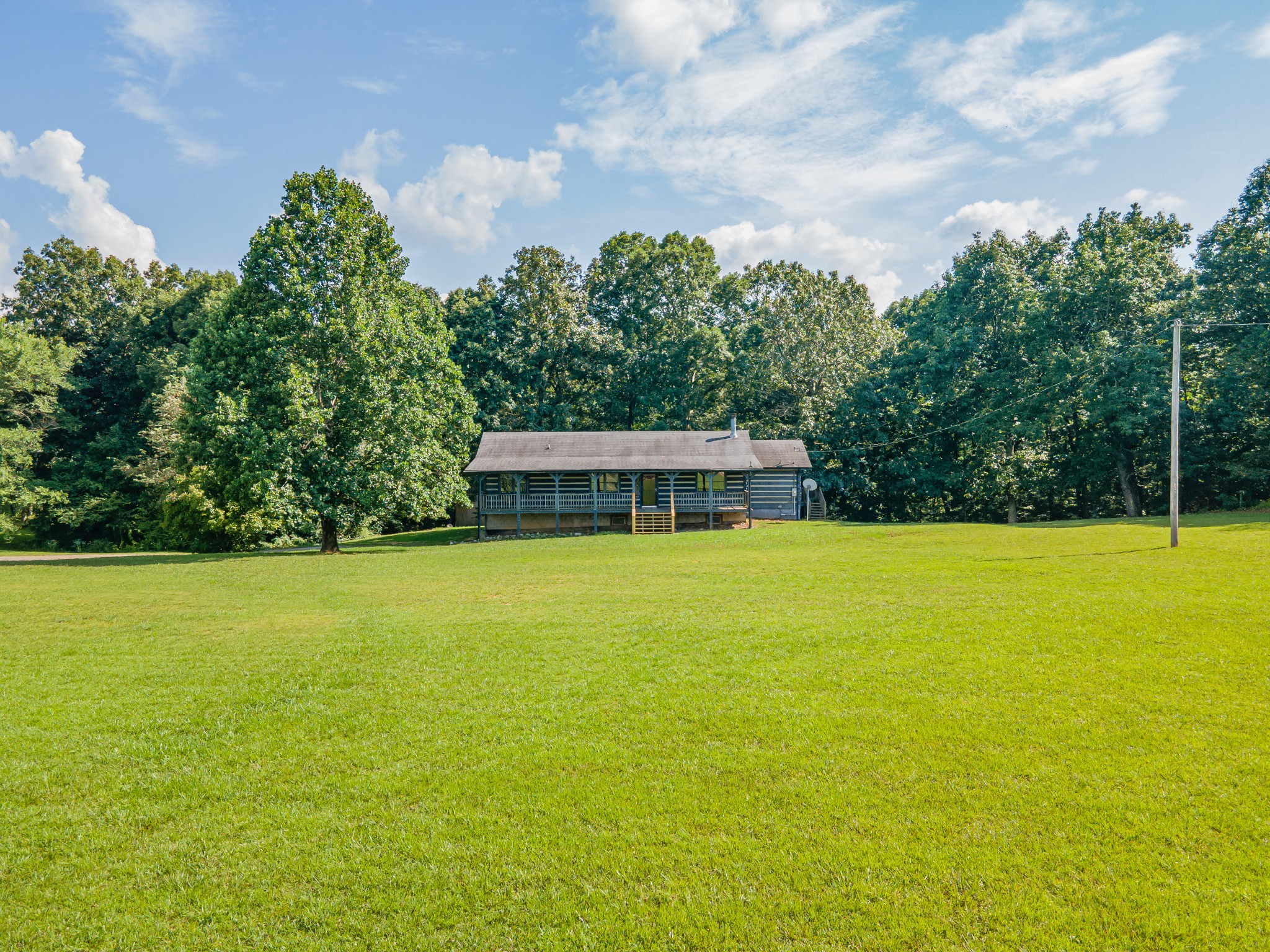 2151 Maysville Road Dickson, TN 37055 - Photo 8 of 98 a view of a swimming pool with an outdoor space and seating area