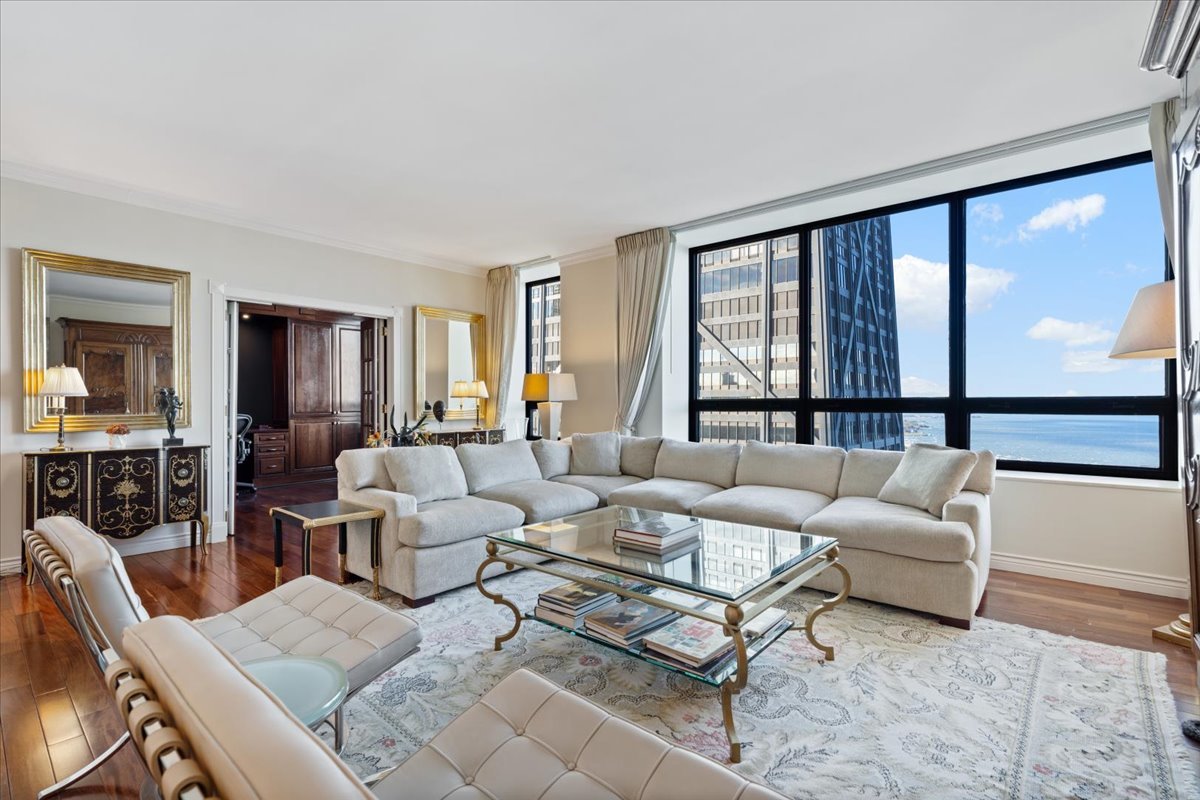 180 East Pearson Street, Unit 4002 Chicago, IL 60611 - Photo 11 of 40 a living room with furniture and a large window
