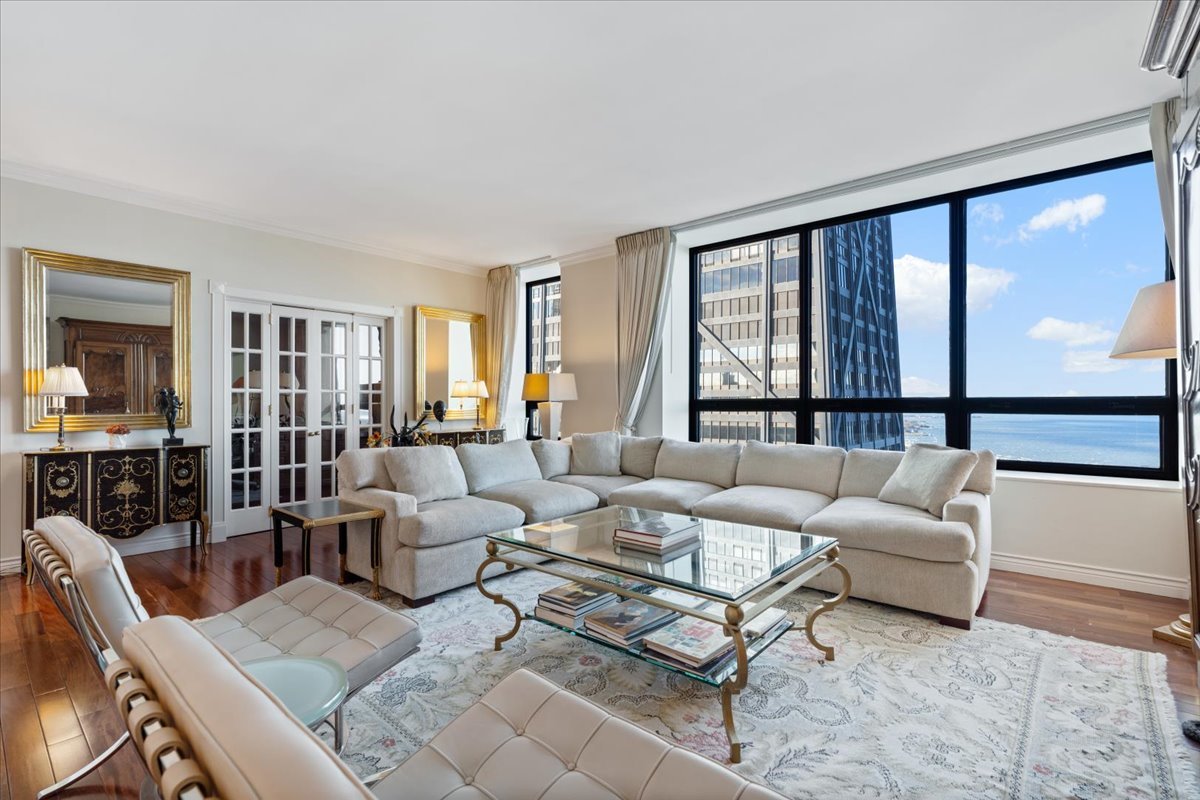 180 East Pearson Street, Unit 4002 Chicago, IL 60611 - Photo 12 of 40 a living room with furniture and a large window
