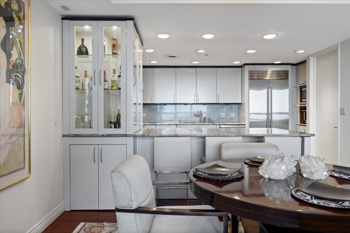 180 East Pearson Street, Unit 4002 Chicago, IL 60611 - Photo 15 of 40 a kitchen with a sink cabinets and window