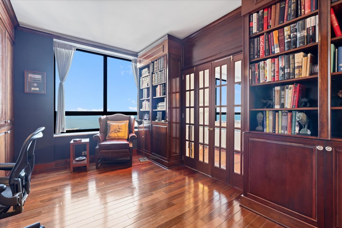 180 East Pearson Street, Unit 4002 Chicago, IL 60611 - Photo 22 of 40 a reading room with lots of furniture and a book shelf