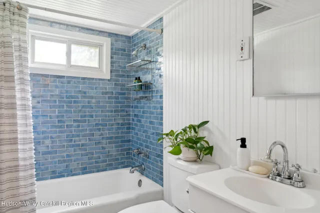 a bathroom with a sink toilet and bathtub