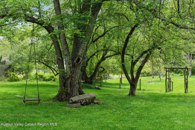 a backyard of a house with lots of green space
