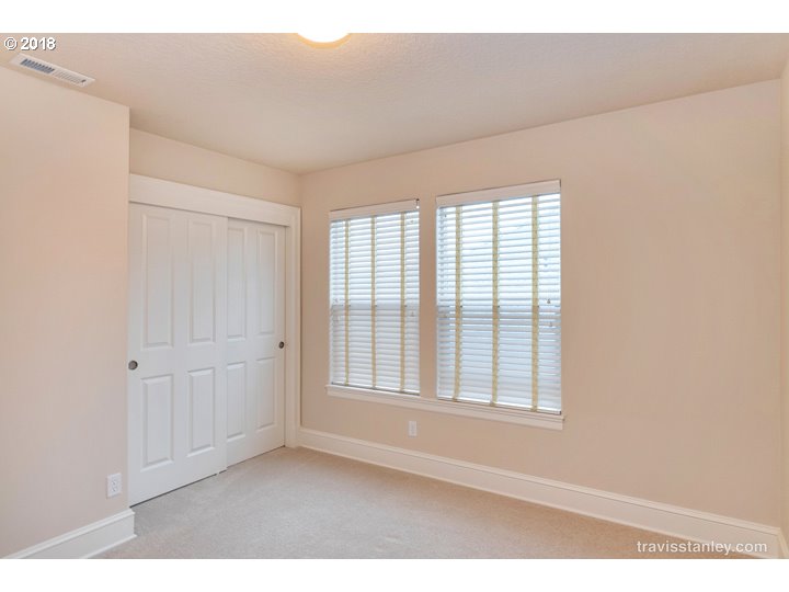 4636 Northwest Corazon Terrace Portland, OR 97229 - Photo 12 of 18 a big room with windows and closet