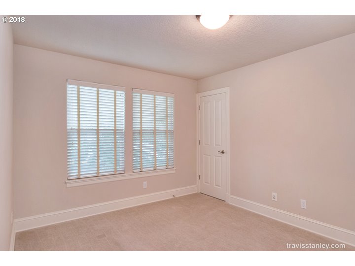 4636 Northwest Corazon Terrace Portland, OR 97229 - Photo 13 of 18 an empty room with wooden floor and windows