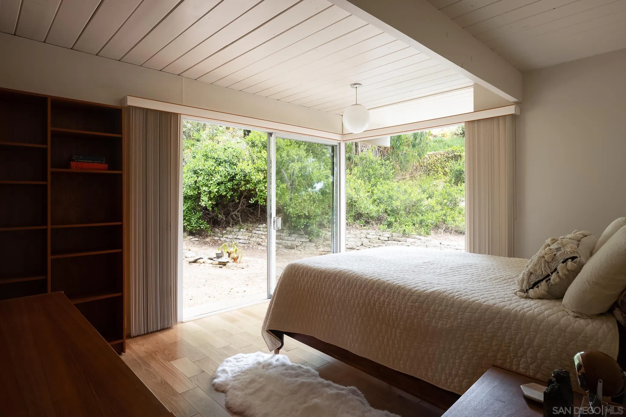 1945 Balboa Avenue Del Mar, CA 92014 - Photo 16 of 25 a bedroom with a bed and a large window with balcony view