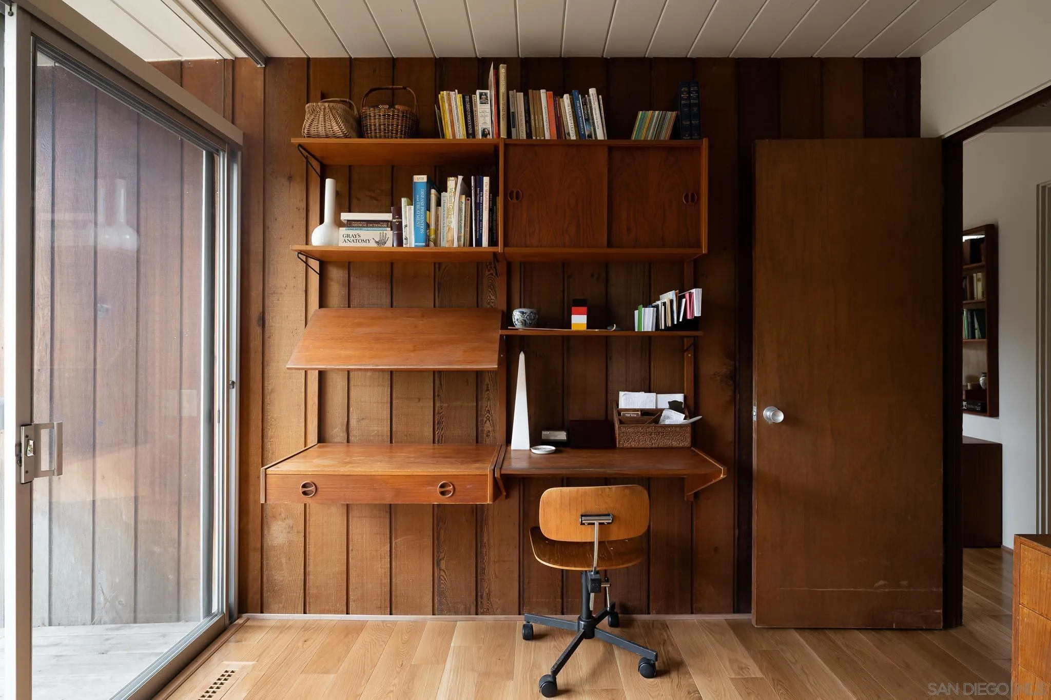 1945 Balboa Avenue Del Mar, CA 92014 - Photo 23 of 25 a kitchen with a refrigerator and table
