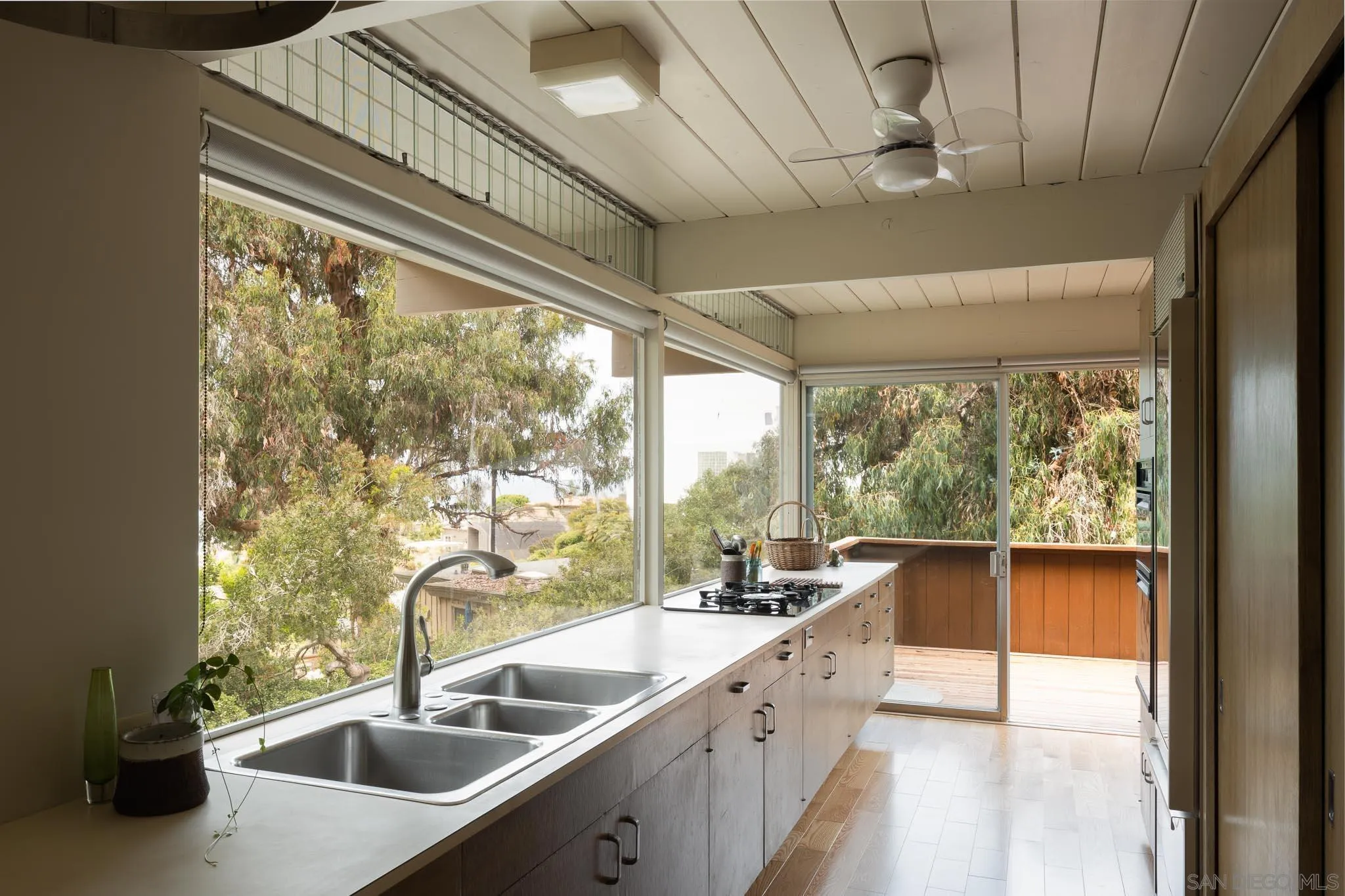 1945 Balboa Avenue Del Mar, CA 92014 - Photo 9 of 25 a kitchen with a sink and a large window