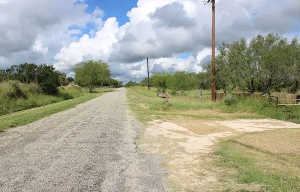 a view of a lake with a big yard