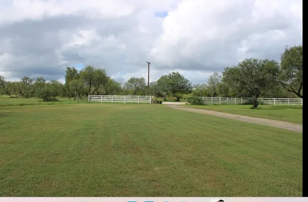 a view of a field with a big yard
