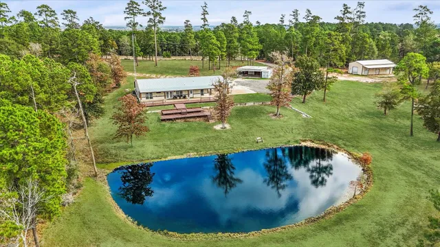 a view of a swimming pool with a yard