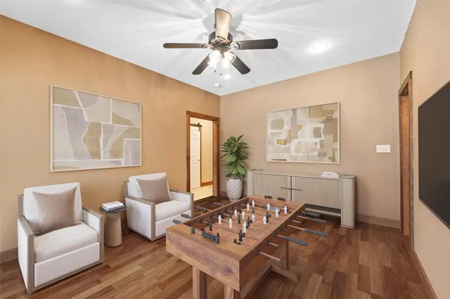 a living room with furniture and wooden floor