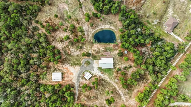 a aerial view of a house with a yard