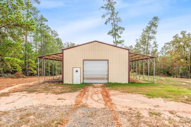 a view of a house with a yard and garage