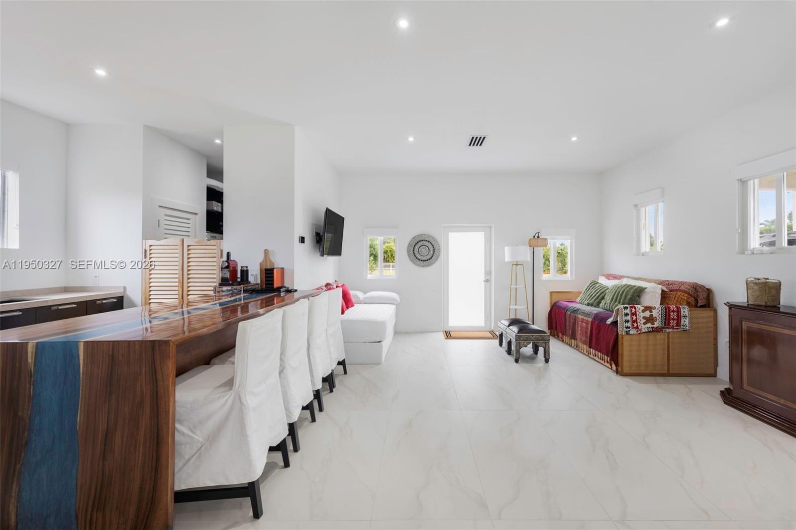 34650 Southwest 218th Avenue Homestead, FL 33034 - Photo 13 of 52 a large white kitchen with stainless steel appliances