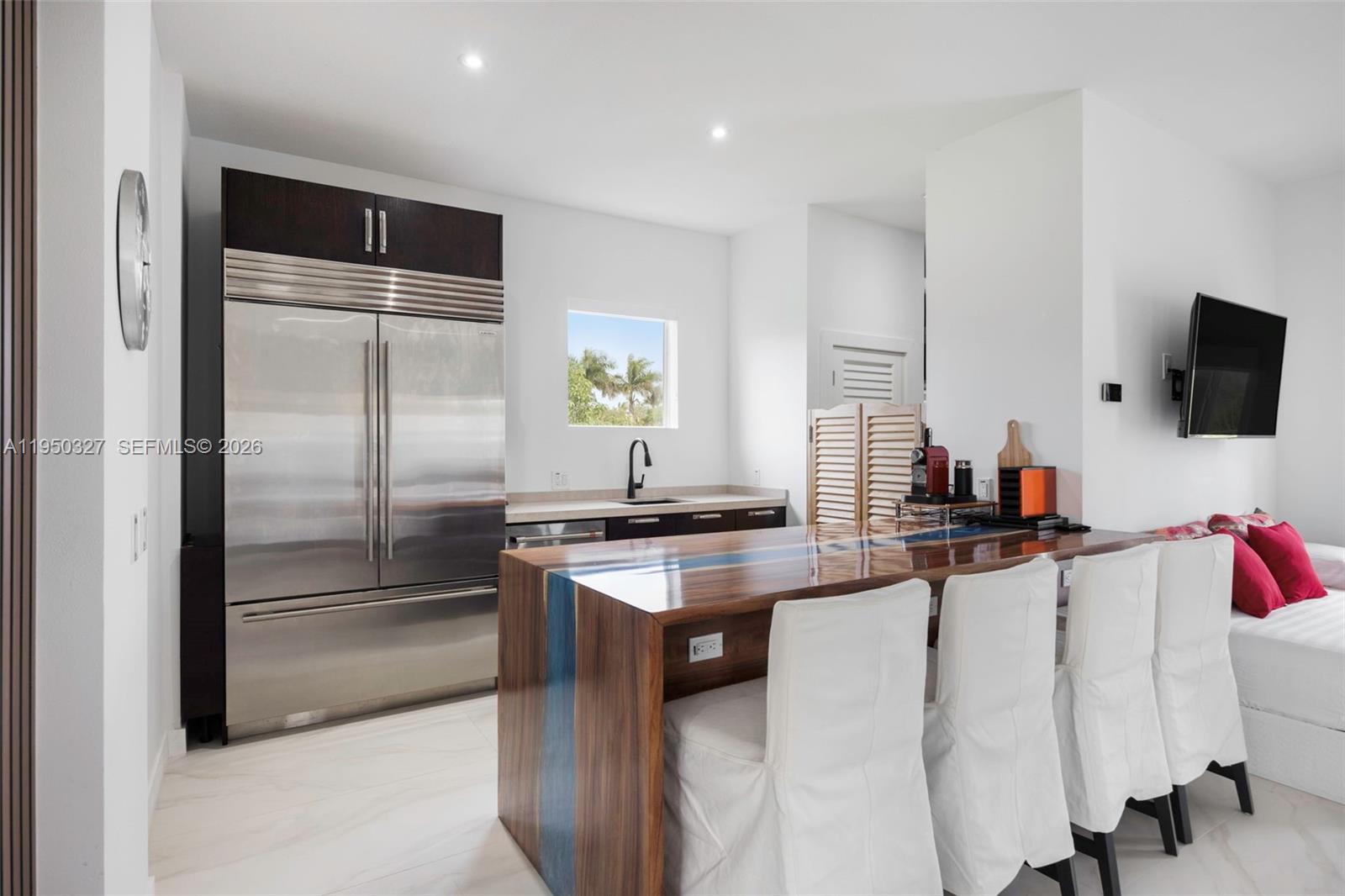 34650 Southwest 218th Avenue Homestead, FL 33034 - Photo 14 of 52 a kitchen with stainless steel appliances granite countertop a refrigerator a stove and a sink
